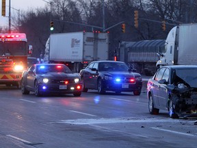 Windsor police work to clear the scene of and accident after a single vehicle crashed in to the back of a transport truck on Huron Church Road near Tecumseh Road in Windsor on Tuesday, January 21, 2013. The accident slowed traffic heading north towards the Ambassador Bridge. (TYLER BROWNBRIDGE/The Windsor Star)