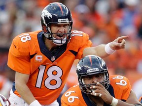 Broncos quarterback Peyton Manning, left, calls an audible at the line of scrimmage in Denver. The  Broncos face the Seattle Seahawks in the Super Bowl Feb. 2 in New York. (AP Photo/Joe Mahoney, File)