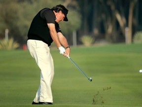 Phil Mickelson plays a shot on the 14th hole during the first round of the Abu Dhabi HSBC Golf Championship at Abu Dhabi Golf Club on January 16, 2014 in Abu Dhabi, United Arab Emirates. (David Cannon/Getty Images)