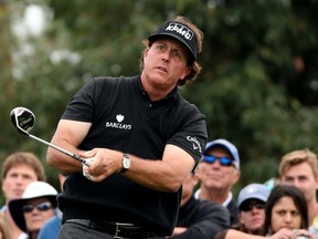 Phil Mickelson watches his tee shot on the 18th hole during the Farmers Insurance Open on Torrey Pines South in La Jolla, Calif., on January 24, 2014. (Stephen Dunn/Getty Images)