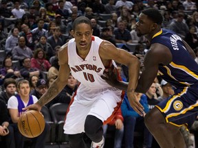 Raptors guard DeMar DeRozan, left, drives around Indiana's Lance Stephenson in Toronto on Wednesday January 1 , 2014. (THE CANADIAN PRESS/Chris Young)