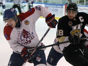 LaSalle's Dylan Denomme, right, tries to steal the puck from Strathroy's Cole Mayo at the Vollmer Centre in LaSalle Wednesday, January 22, 2013. The Viper beat the Rockets 5-4. (TYLER BROWNBRIDGE/The Windsor Star)