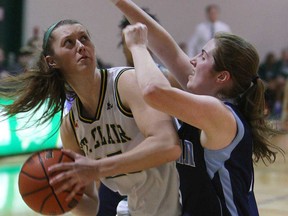 St. Clair's Jessica Gordon, left, makes a move against Sheridan's Samantha Lovat at St. Clair College in Windsor on Friday, January 24, 2013.                           (TYLER BROWNBRIDGE/The Windsor Star)