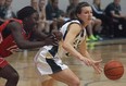 Fanshawe's Stephanie Antwi, left, and St. Clair's Jaide Lyons battle for the ball during OCAA women's basketball action Wed. Jan. 15, 2014, in Windsor. (DAN JANISSE/The Windsor Star)