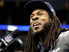 Seattle's Richard Sherman answers a question during media day for Super Bowl XLVIII Tuesday, Jan. 28, 2014, in Newark, N.J. (AP Photo/Jeff Roberson)