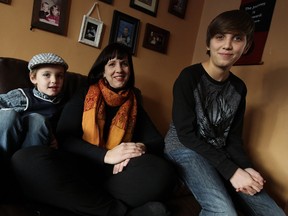 Colin, left, Cathy and Evan Zagaglioni are photographed in their home in Windsor. The three are featured in The Motherload, a  documentary about single mothers raising a family and having a career. (TYLER BROWNBRIDGE / The Windsor Star)