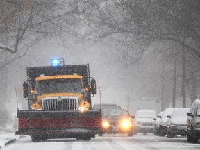 A city snow plow toils on a Windsor street in this 2012 file photo. (Dax Melmer / The Windsor Star)