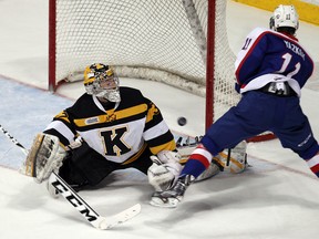 Windsor's Nikita Yazkov, right, is stopped by Kingston's Matt Mahalak at the WFCU Centre. (TYLER BROWNBRIDGE/The Windsor Star)