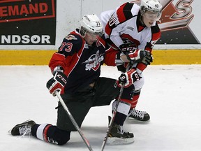 Windsor's Remy Giftopoulos, left, battles Ottawa's Alex Lintuniemi at the WFCU Centre in Windsor  on Thursday, January 9, 2013. (TYLER BROWNBRIDGE/The Windsor Star)