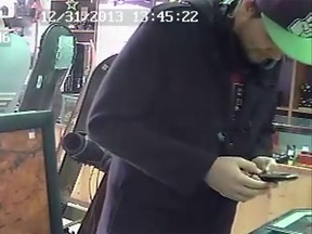 Windsor police are searching for a suspect wanted in connection with a theft from an Ottawa Street pawn shop on Jan. 4, 2014. (Handout/The Windsor Star)