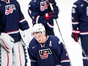 USA's Matt Grzelcyk looks down after his team lost the World Junior Hockey Championships quarter final between USA and Russia in Malmo, Sweden on Thursday, Jan. 2, 2014. (AP Photo / TT News Agency / Andreas Hillergren)