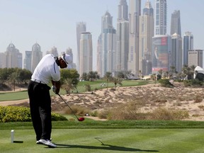 Tiger Woods tees off on the eighth hole during the Champions Challenge as a preview for the 2014 Omega Dubai Desert Classic on January 28, 2014 in Dubai, United Arab Emirates.  (Francois Nel/Getty Images)