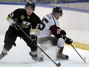 LaSalle's Andrews Burns, left, steals the puck form Chatham's Michael Verboom at the Vollmer Centre in LaSalle on Wednesday, January 29, 2014. (TYLER BROWNBRIDGE/The Windsor Star)