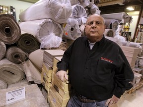 Steven Shanbon, owner of Hi! Neighbor Floor Covering Co. on Wyandotte St. E., isn't impressed by the province increasing minimum wage to $11 an hour. Photographed Jan. 30, 2014. (Tyler Brownbridge / The Windsor Star)