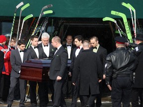 Pallbearers carry Kevin Siddall out of Corpus Christi Roman Catholic Church at the conclusion of his funeral, Saturday, Feb. 8, 2014.  Siddall died on Feb. 4 at the age of 14 from non-Hodgkin lymphoma.  (DAX MELMER/The Windsor Star)