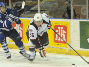 Windsor's Josh Ho-Sang, right, is checked by Mississauga's Greg DiTomaso Friday at the Hershey Centre. (Photo by Iain Colpitts/The Mississauga News)