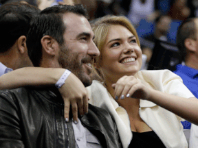 Tigers pitcher Justin Verlander, left, and model Kate Upton watch the first half of the NBA game between the Orlando Magic and the Oklahoma City Thunder in Orlando. (AP Photo/John Raoux)