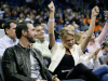 Tigers pitcher Justin Verlander, left, and model Kate Upton watch the first half of the NBA game between the Orlando Magic and the Oklahoma City Thunder in Orlando. (AP Photo/John Raoux)