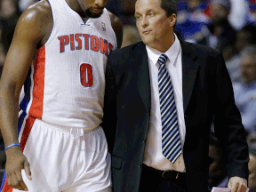 Detroit's Andre Drummond, left, talks with interim head coach John Loyer during the first half against the San Antonio Spurs in Auburn Hills, Mich. (AP Photo/Carlos Osorio)