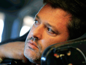 Tony Stewart, driver of the #14 Mobil 1/Bass Pro Shops Chevrolet, sits in his car in the garage area during practice for the NASCAR Sprint Cup Series Sprint Unlimited at Daytona International Speedway Friday n Daytona Beach, Fla.  (Photo by Jamie Squire/Getty Images)