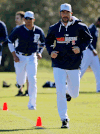 Detroit Tigers pitcher Justin Verlander, right, leads a group through warm-ups on the team’s first day of baseball spring training for pitchers and catchers Friday in Lakeland, Fla. (AP Photo/Gene J. Puskar)