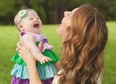 Tara McCallan, formerly of Windsor, laughs with her daughter Pip, who has Down Syndrome, and is the inspiration for her website Happy Soul Project. (Courtesy of the McCallan family)