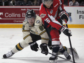 Windsor's Josh Ho-Sang, right, is checked by London's Remi Elie at the WFCU Centre. (DAN JANISSE/The Windsor Star)