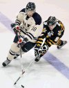 Windsor's Mickey Renaud, left, is checked by Sarnia's Steven Stamkos at Windsor Arena in 2007.    (TYLER BROWNBRIDGE/The Windsor Star)