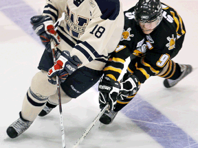 Windsor's Mickey Renaud, left, is checked by Sarnia's Steven Stamkos at Windsor Arena in 2007.    (TYLER BROWNBRIDGE/The Windsor Star)