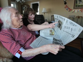 Barbara Keyes cares for her mother Alice Keyes, 89, at their Kingsville, Ont., Wed. Feb. 12, 2014. They enjoy reading the newspaper together. (DAN JANISSE/The Windsor Star)