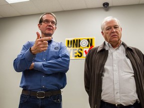 In this Feb. 14, 2014, photo, United Auto Workers President Bob King, left, and Dennis Williams, now secretary-treasurer for the union, discuss the union's 712-626 defeat in an election at the Volkswagen plant in Chattanooga, Tenn. The UAW on Friday, Feb. 21, 2014, filed an objection with the National Labor Relations Board seeking to vacate the result and order a new election. (AP Photo/Erik Schelzig)