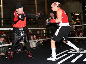 The Windsor Amateur Boxing Club was the beneficiary of a fundraising boxing match between Ed Agnew and local Olympian Mary Spencer. Agnew decided to hold a fundraiser for the club and mark his 80th birthday at the same time. The event was held Monday, Feb. 24, 2014, at the Walkerville Brewery in Windsor, Ont. Agnew went three short rounds with Spencer where more gags were exchanged than punches. Agnew and Spencer are shown during the match. (DAN JANISSE/The Windsor Star)