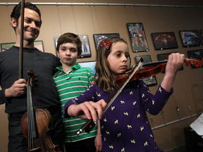 Tino Popovic performs with his children Dimitri and Tatiana in the Windsor Star News Cafe in Windsor on Tuesday, February 25, 2014. (TYLER BROWNBRIDGE/The Windsor Star)