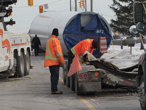 County Road 42 between the Eleventh Concession and Banwell Road in Tecumseh was closed for several hours after a section of a wind turbine dislodged during transportation by truck.  Towing crews spent several hours placing the structure back on a rear transportation trailer following the accident.  There were no injuries.  (JASON KRYK/The Windsor Star)