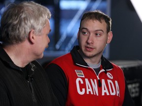 Paralympian Corbin Watson chats with Bob Duff in the Windsor Star News Cafe in Windsor on Wednesday, February 26, 2014. (TYLER BROWNBRIDGE/The Windsor Star)