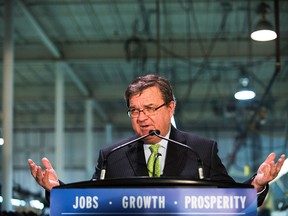 Minister of Finance Jim Flaherty speaks at a pre-budget press event at the factory for the Canadian shoe company Mello Shoes in Toronto on Friday, February 7, 2014. (THE CANADIAN PRESS/Aaron Vincent Elkaim)