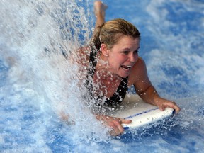 Kelly Steele rides the flowrider at the Adventure Bay Family Water Park in Windsor on Wednesday, January 29, 2014. (TYLER BROWNBRIDGE/The Windsor Star)