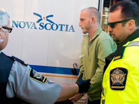 Blake Leggette is escorted into Halifax Provincial Court on Tuesday, February 25, 2014. Leggette and his girlfriend Victoria Henneberry are charged in connection with the theft of missing university student Loretta Saunders car. (RYAN TAPLIN/STAFF)