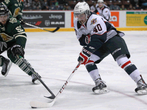 Windsor's Ryan Moore, right, is checked by London's Alex Basso at the WFCU Centre. (DAX MELMER/The Windsor Star)