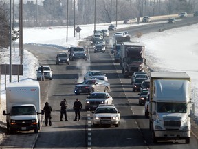 Windsor Police Traffic officers block the westbound lanes of the E.C. Row Expressway following a series of early morning accidents near Dominion Boulevard. (JASON KRYK/The Windsor Star)