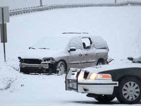 Windsor police closed a portion of Central Avenue at Temple Drive after a minivan was involved in a single vehicle accident in the early morning, Sunday, Feb. 9, 2014.  One woman was taken to the intensive care unit with serious injuries.  (DAX MELMER/The Windsor Star)