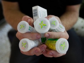 File photo of pain medications. “Family physicians who prescribe controlled substances are at risk of being subjected to minor, major or even severe abuse,” the authors write in the journal, Canadian Family Practice. “A national discussion to deal with this issue is needed.” (Dario Ayala for Postmedia News)
