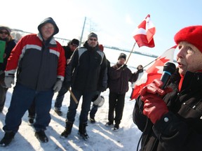 Peggy Noonan, a local activist, speaks during a small rally at Assumption Park in Windsor, Ont., Sunday, Feb. 9, 2014.  People were protesting the appeal by Detroit Bulk Storage to store petcoke along the Detroit River in Detroit.   (DAX MELMER/The Windsor Star)