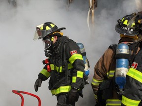 In this file photo, Windsor firefighters are at the scene of a garage fire at 1107 Hall Ave.  February 26, 2014. There were no injuries but the garage was a total loss. (NICK BRANCACCIO/The Windsor Star).