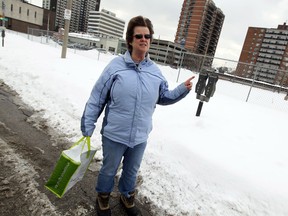 Crystal Dufour complains about those who haven't cleared snow in Windsor on Monday, February 10, 2014. The city is cracking down on and ticketing property owners who have failed to remove the snow from their sidewalks.                                  (TYLER BROWNBRIDGE/The Windsor Star)