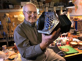 Frank Edgley with his hand-crafted concertinas on Jan. 15, 2014, that are produced in Windsor, Ont. (DAN JANISSE/The Windsor Star)