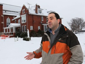 Marc Pillon is shown in front of the rectory at the St. Joseph Church in River Canard on Sunday, Feb. 2, 2014. He is concerned that the historic structure will be torn down. (DAN JANISSE/The Windsor Star)
