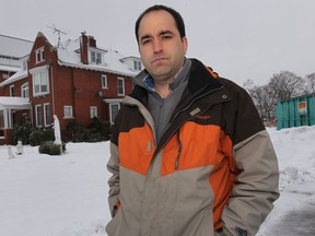 Marc Pillon is shown in front of the rectory at the St. Joseph Church in River Canard on Sunday, Feb. 2, 2014. He is concerned that the historic structure will be torn down. (DAN JANISSE/The Windsor Star)