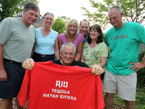 In this file photo, Dr. Ray LaRocque is surrounded by Mike LaRocque, left, Mary LaRocque, Lynn Morgan, Steve LaRocque, Jeanne LaRocque and Tim LaRocque at his home in Windsor on Tuesday, May 15, 2012. LaRocque has been taking his entire family on an annual vacation. The trips have involved up to 63 people.         (TYLER BROWNBRIDGE / The Windsor Star)