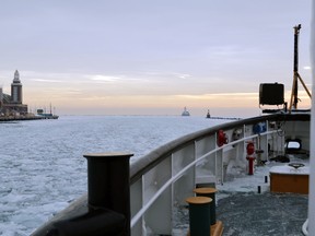 In this Feb. 12, 2014 photo provided by the U.S. Coast Guard the icebreaker Biscayne Bay passes Chicago's Navy Pier, left, as it through the ice covered waters of Lake Michigan on it's way to Indiana. The Coast Guard's team of nine icebreakers have logged four times more hours this season than the average for the same period in recent years. (AP Photo/U.S. Coast Guard, Chief Petty Officer Alan Haraf)